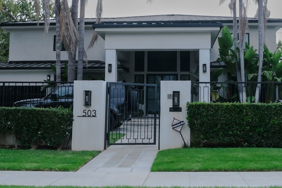 The clean, inviting exterior of a modern suburban home under a clear blue sky, representing a desirable property successfully marketed online beyond a traditional 'For Sale' sign.