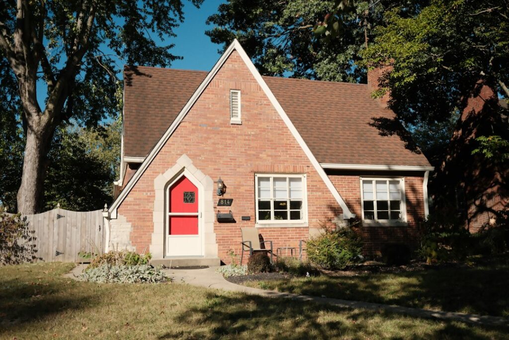 Beautiful single-family brick home with a green lawn and excellent curb appeal, representing a smart real estate investmen...