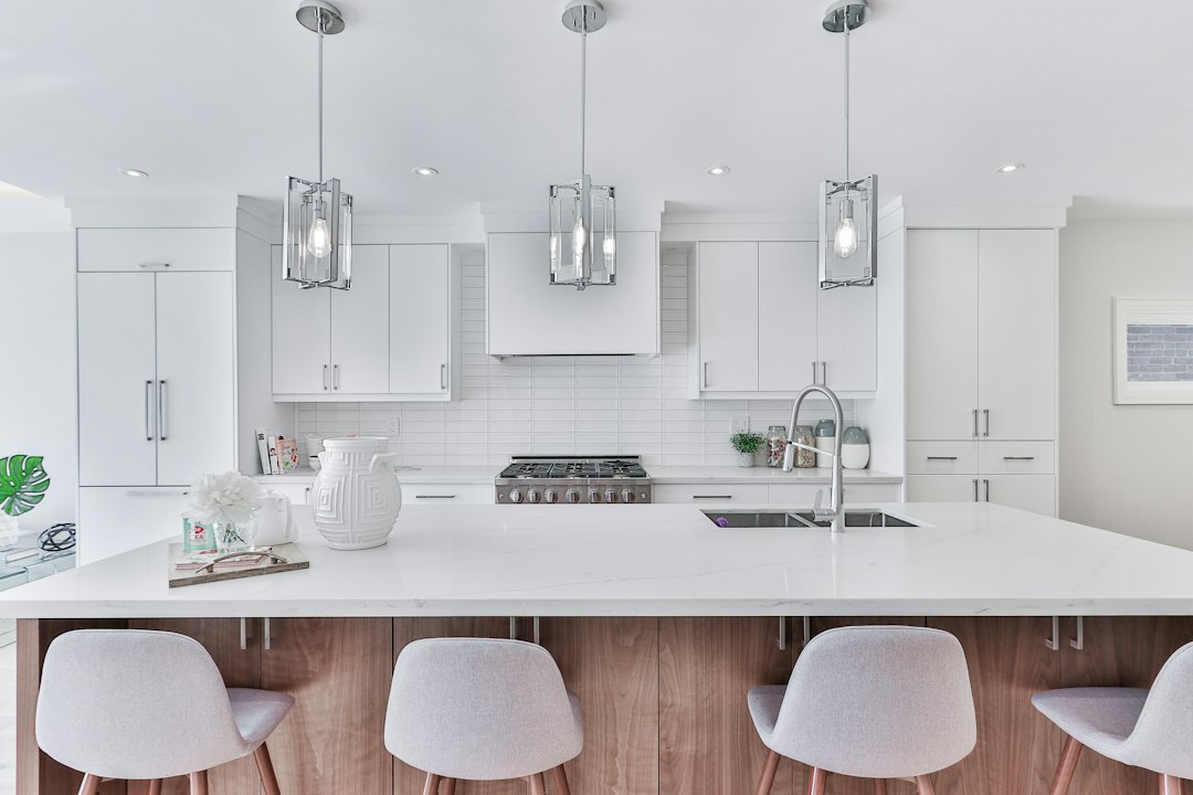 The bright, clean interior of a newly renovated modern kitchen, a high-return upgrade for boosting a property's earning potential.